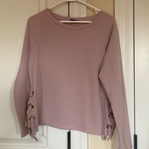 Ellie Tahari dusty pink top with cute side details.